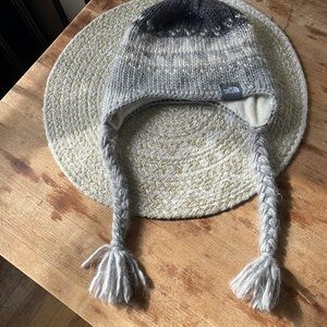 Cozy winter hat with braids.